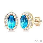 5x3 MM Oval Shape Blue Topaz and 1/8 Ctw Round Cut Diamond Halo Semi-Precious Stud Earrings in 14K Yellow Gold