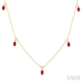 5x3 MM Oval Shape Ruby and 1/4 Ctw Round Cut Diamonds Precious Station Necklace in 14K Yellow Gold