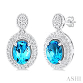 7X5 MM Oval Cut Blue Topaz and 1/20 Ctw Round Cut Diamond Semi-Precious Earring in Sterling Silver