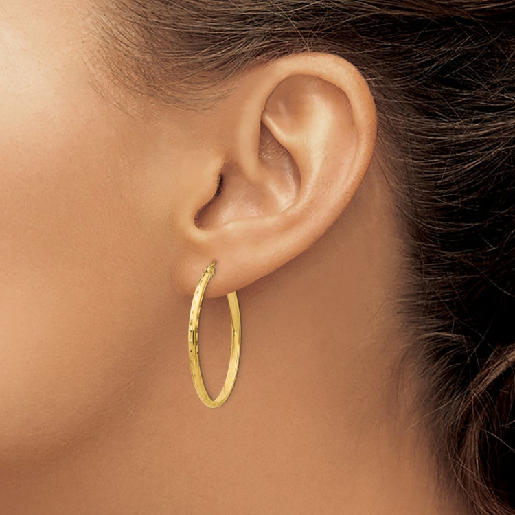 14k 2.5x35mm Lightweight Diamond-cut Oval Tube Hoop Earrings