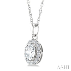 5x3 MM Oval Shape White Topaz and 1/20 Ctw Round Cut Diamond Halo Semi-Precious Pendant with Chain in 14K White Gold