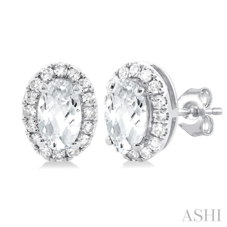 5x3 MM Oval Shape White Topaz and 1/8 Ctw Single Cut Diamond Halo Semi-Precious Stud Earrings in 10K White Gold