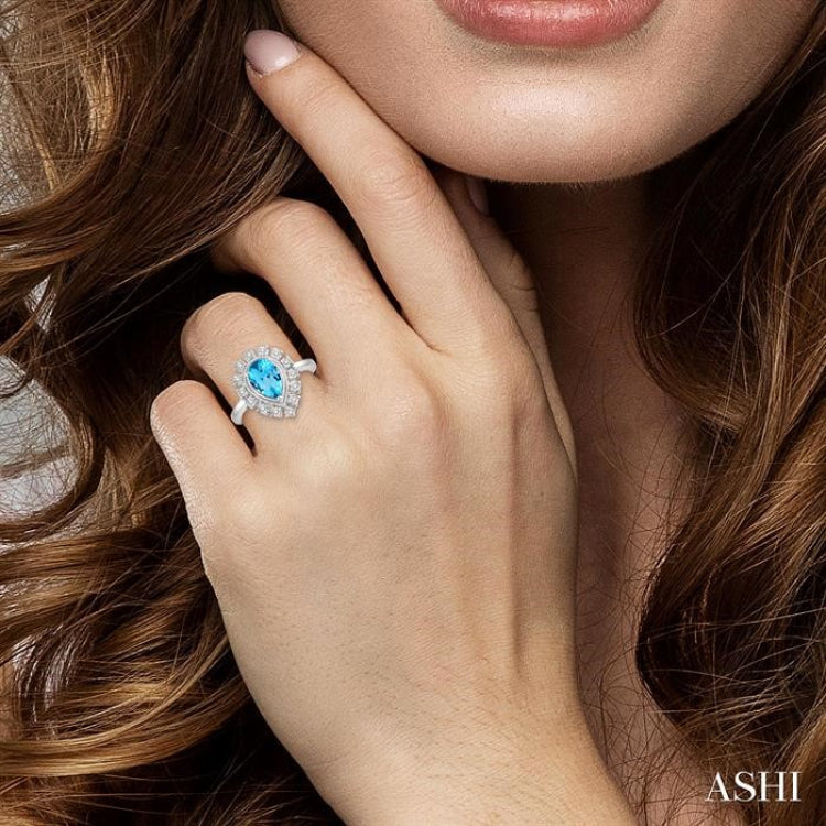 9x6 MM Pear Shape Blue Topaz and 1/10 Ctw Lattice Round Cut Diamond Semi-Precious Ring in 10K White Gold