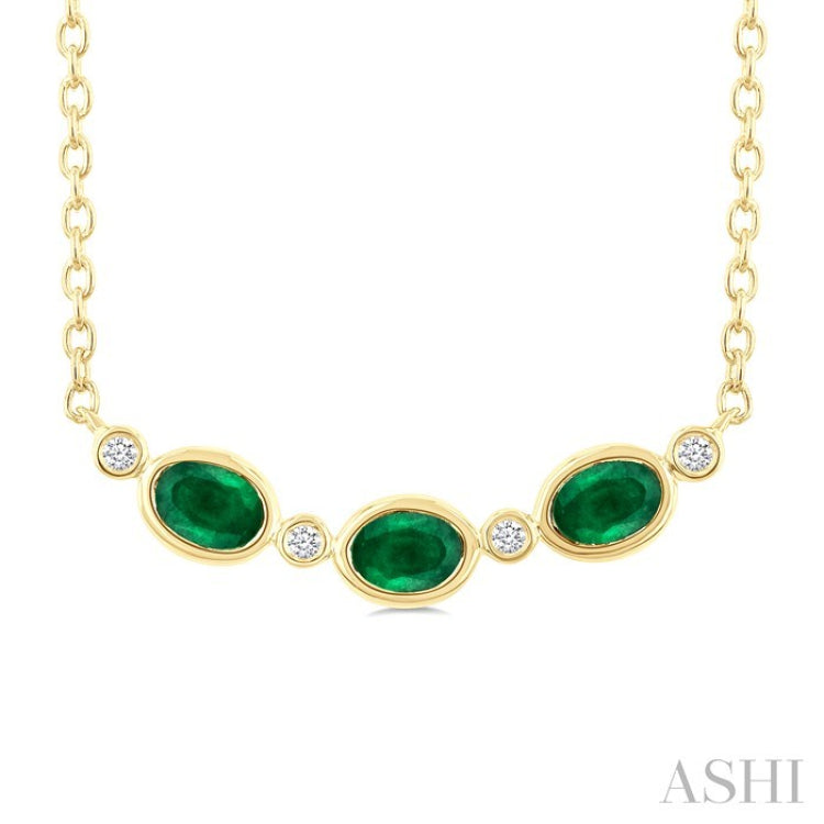4X3MM Oval Cut Emerald and 1/50 Ctw Bezel Set Round Cut Diamond Precious Fashion Necklace in 10K Yellow Gold