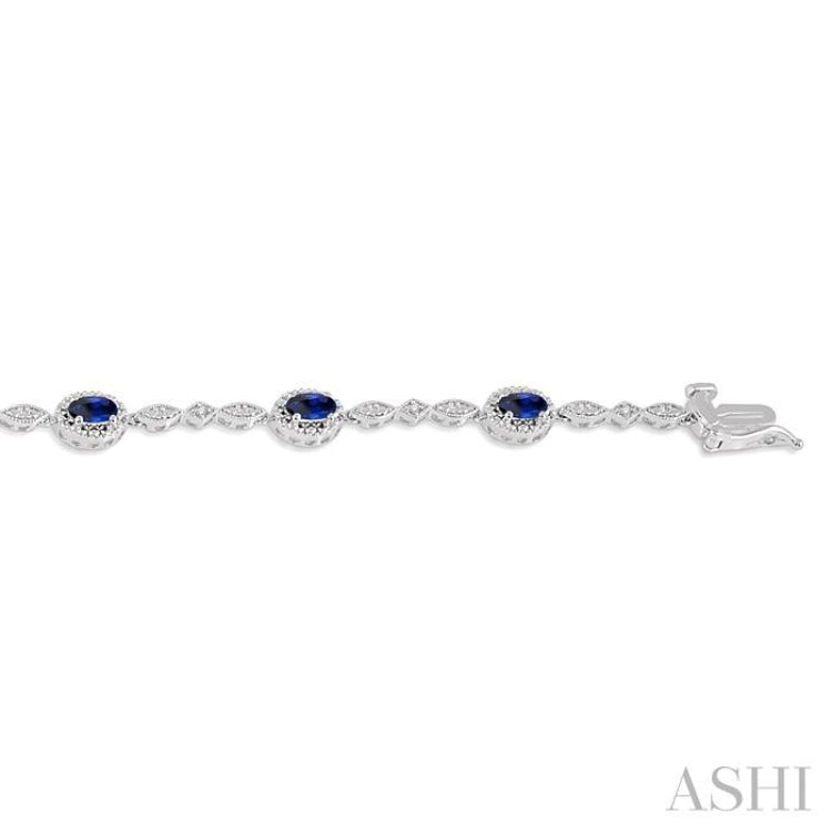 5x3 MM Oval Cut Sapphire and 1/20 Ctw Round Cut Diamond Bracelet in 14K White Gold