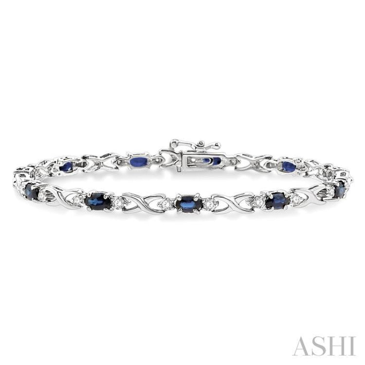 5x3 MM Oval Cut Sapphire and 1/10 Ctw Single Cut Diamond Bracelet in 10K White Gold