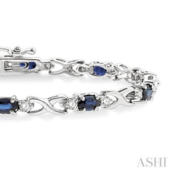 5x3 MM Oval Cut Sapphire and 1/10 Ctw Single Cut Diamond Bracelet in 10K White Gold