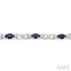 5x3 MM Oval Cut Sapphire and 1/10 Ctw Single Cut Diamond Bracelet in 10K White Gold