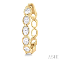 1 1/10 Ctw Bezel Set Oval Cut Diamond Fashion Hoop Earring in 14K Yellow Gold