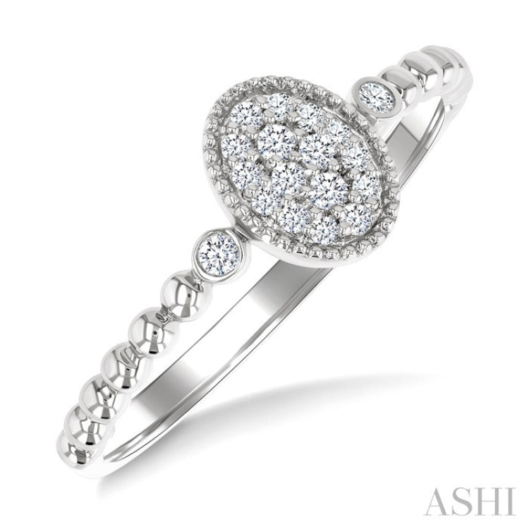 1/8 Ctw Petite Bead Shank Oval Center Round Cut Diamond Fashion Ring in 10K White Gold