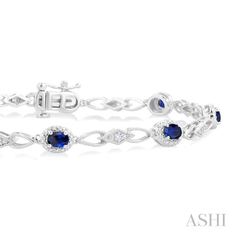 1/20 Ctw Oval Cut 4X3MM Sapphire and Round Cut Diamond Precious Fashion Bracelet in 10K White Gold
