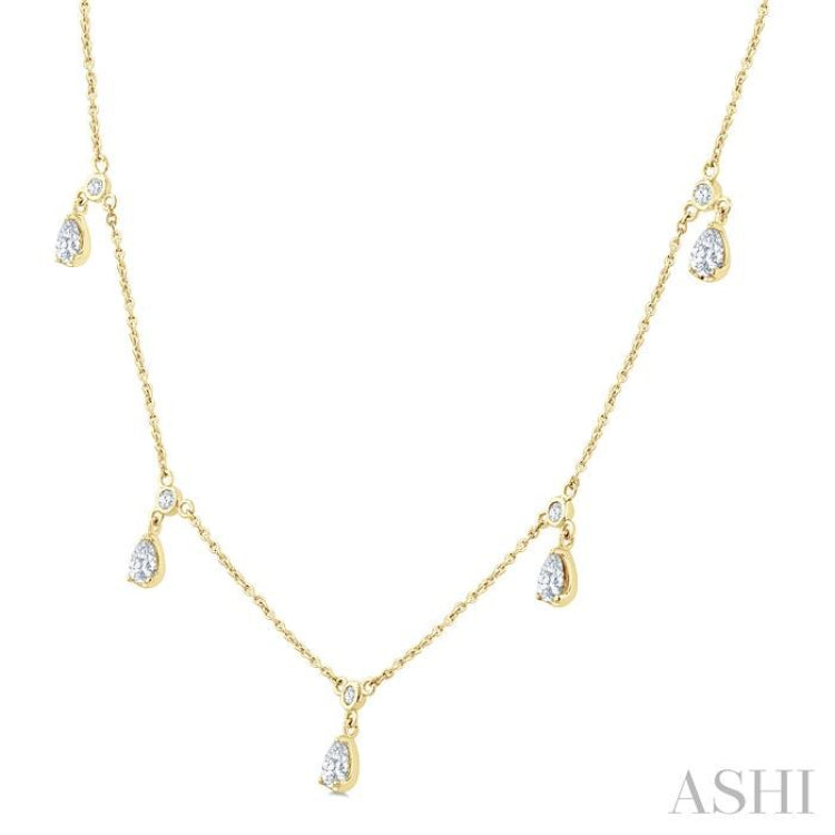 5/8 Ctw Dangle Pear and Round Cut Diamond Station Necklace in 14K Yellow Gold