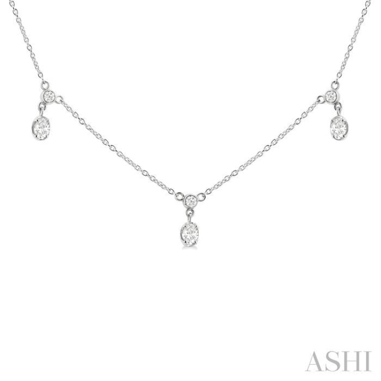 5/8 Ctw Dangle Oval and Round Cut Diamond Station Necklace in 14K White Gold