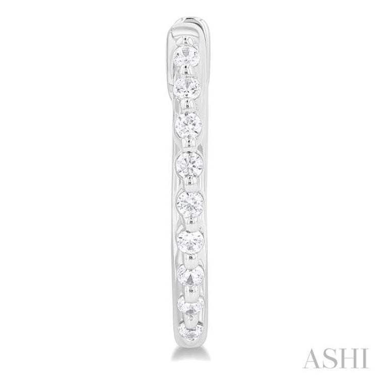 1/6 Ctw Petite Shared Prong Round Cut Diamond Hoop Earring in Sterling Silver