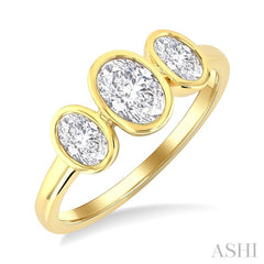 1 Ctw 3-Stone Bezel Set Oval Cut Diamond Ring in 14K Yellow Gold